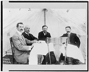 Mexican Peace Commissioners José María Pino Suárez, Dr. Vazquez Gomez, Francisco I. Madero, and Judge Carbajal seated around table, during the Mexican Peace Commission at Ciudad Juarez, LCCN97508873