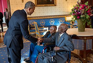 Obama greets Richard Overton with Earlene Love-Karo