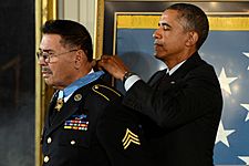 President Barack Obama, right, awards a Medal of Honor to retired U.S. Army Sgt. Santiago J. Erevia during a ceremony at the White House in Washington, D.C., March 18, 2014 140318-D-DB155-001