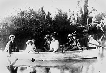 StateLibQld 2 122214 Group of men, women and children rowing across Lagoon Creek at Beldan's, North Eton, Queensland, 1900-1910.jpg