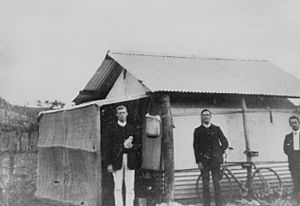 StateLibQld 2 188239 Teacher and friends standing near a dwelling in the mining town, Mount Elliott, Queensland
