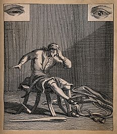 A man in a workshop with a hand over his eyes in anguish whi Wellcome V0015867