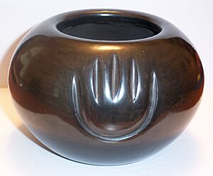 Black bowl with bear paw by Angela Baca