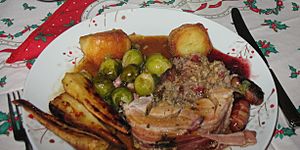 Christmas Dinner 2014 Stuffed Roast Turkey leg, roast potatoes, parsnips, brussel sprouts, pigs in blankets, cranberry sauce & gravy (48122315877)