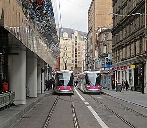 Two trams in Stephenson Street, geograph-5012475-by-John-Sutton