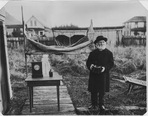 William Duncan late in life, exhibiting to friends for photographing the canvas, hammock, clock, water bottle, and... - NARA - 297897