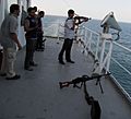 Armed guard escort on a merchant ship