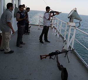Armed guard escort on a merchant ship