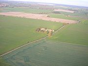 Aerial view of Beacon Hill farm, showing the route of Mareham Way through the fields.  This aerial view is somewhat washed out because it was photographed through the side window of a light aircraft.