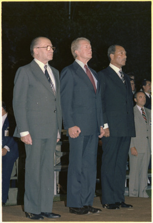 Close up of Menahem Begin, Jimmy Carter and Anwar Sadat attending a military exhibition during the Camp David Summit. - NARA - 181142