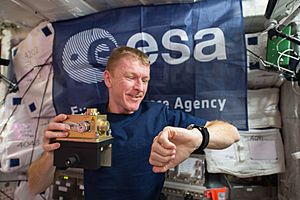 ISS-46 Timothy Peake prepares to install a sensor inside the Columbus module