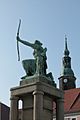 Statue in Grossenhain town square looking north to the spire of the Marienkirche